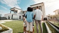 Love, new house and family in their backyard together looking at their property or luxury real estate. Embrace, mortgage and parents with their children on grass at their home or mansion in Canada. - Fox News